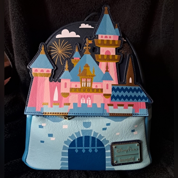 disneyland mini backpack EXCLUSIVE DROP: Loungefly Disney Parks Sleeping Beauty Castle & Mickey Mouse and an embroidered starry sky is featured on the straps Loungefly Monsters University Mini Backpack